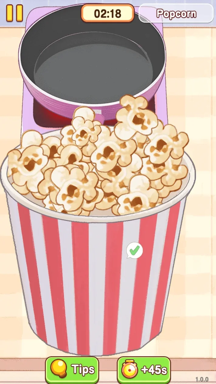 Completed striped bucket of popcorn with a green check mark